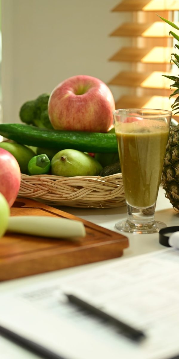 Fruit and vegetable on chopping board with Nutrition Facts on table.